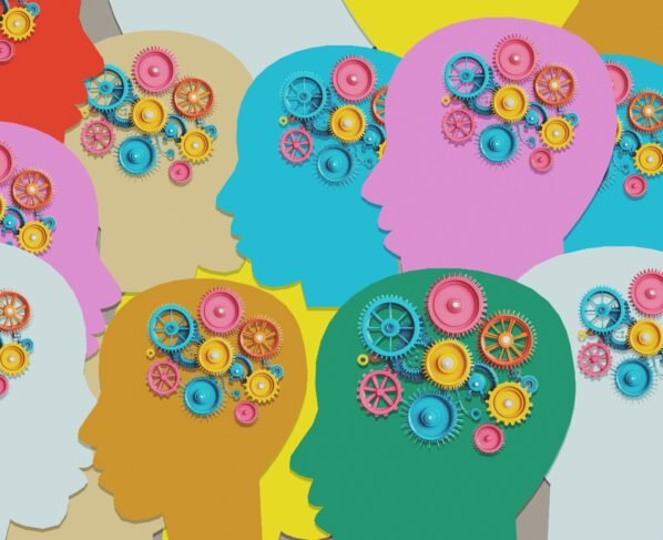 Ilustração mostra várias cabeças de papel colorido com engrenagens no cérebro - Metrópoles TDAH - Autismo - Autistas
